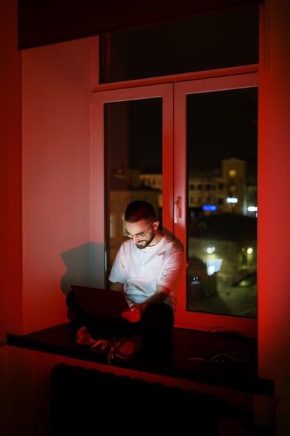 A person is sitting in a dimly lit room with their face partially hidden, watching a true crime show on a laptop. Their expression is a mix of fascination and concern.